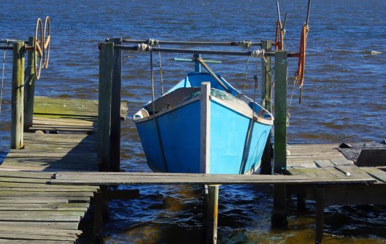 A beautiful shot of a fishing boat on the seashore